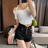 Shorts casuales negros de tiro alto de diseñador con cordones laterales para mujer, versión coreana otoño/invierno 2026, versátiles y adelgazantes, adecuados para usar como prenda exterior