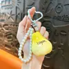Llavero de Perla Naranja con Cuentas, Único y Elegante, Colgante de Cadena para Teléfono Móvil de Moda de Nicho, Accesorio Fresco y Versátil al por Mayor