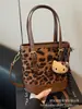 Bolso con Estampado de Leopardo para Mujer Otoño e Invierno 2025 Nuevo Versátil Diseño de Nicho Bolso de Hombro Cruzado Popular Bolso Cubo Portátil