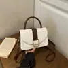 Bolso de mano pequeño elegante de alta gama para mujer, nuevo bolso cruzado de moda versátil 2026, bolso de hombro tipo silla de montar sensación popular de internet