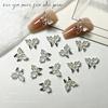 Accesorios de uñas de mariposa luminosa de celebridades en línea populares, nuevos accesorios de uñas de mariposa de resina tridimensional hechos a mano, venta al por mayor