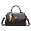 Bolsa de Mão Retrô Feminina 2026 Outono/Inverno Nova Elegante de Nicho Luxo Leve Bolsa de Ombro Único para o Trabalho Transversal Pequena Quadrada