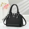 Bolso de concha retro de nicho transfronterizo para mujer, nuevo bolso de mano versátil en bloques de color con un toque de alta gama, adecuado para ir al trabajo, bolso de hombro y cruzado