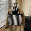 Bolsa Grande de Lona Listrada para Mulheres Outono e Inverno 2026 Nova Bolsa de Ombro de Grande Capacidade Bolsa Tote Casual Fashion