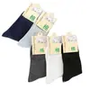 Calcetines para hombre de tubo medio empaque individual otoño e invierno color liso grosor medio casual de negocios calcetines de algodón fabricantes venta al por mayor calcetines para hombre