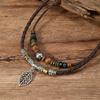 Collar de joyería tejido a mano con nudos de cuentas de madera multicapa, aleación de mariposa artística retro europea y americana