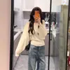 Suéter casual de punto con cuello en V holgado y mangas de murciélago para mujer, nuevo modelo de principios de otoño en color albaricoque, de manga larga, adelgazante, versátil y que marca la cintura