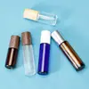 Botella de empaque de perfume de 10 ml tapa con veta de madera botella de vidrio transparente esmerilado botella de color con bola rodante tapa botella de aceite en stock