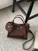 Bolsos de nicho súper populares transfronterizos para mujer 2026 nuevo estilo bolso cruzado tipo cubo bolso pequeño de alta gama exquisito para salir