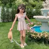 Trajes de Baño al por Mayor para Madre e Hija 2025 Nuevo Estilo de Falda Dividida con Volantes y Moño Traje de Baño para Niños Pequeños y Medianos para Padres e Hijos para Mujeres
