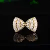 Broche de solapa con diseño de lazo estilo coreano anti-luz versátil con micro-diamantes, broche de diseño para el temperamento femenino, joyería