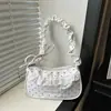 Bolsa feminina tipo baguette de ombro 2026 verão nova nicho renda plissada doce e cool estilo patchwork pequena bolsa de ombro