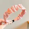 Faixa de cabeça larga de tricô minimalista e elegante estilo coreano para mulheres, novo modelo 2026, adequada para uso diário, projetada para realçar a aparência da linha do cabelo e pode ser usada como faixa de cabeça para lavar o rosto ou presilha de cabelo