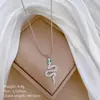 [acero de titanio de cuerpo completo] personalidad de serpiente de ojos verdes estilo minimalista collar de oro genuino en el horno cadena de clavícula femenina ins net red