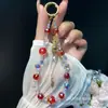 Nueva Cadena para Teléfono Móvil Estilo Chino Aleación Incrustada de Diamantes Bolsa de la Suerte Flor de Año Nuevo Bola Colgante de Cristal Colgante de Bolsa de la Suerte Estilo Chino Venta al por Mayor