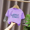 Camiseta de manga larga de algodón puro para niños, nuevo modelo primavera y otoño 2026, camiseta base estampada para niños mayores y pequeños, top tipo dos piezas falso