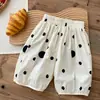 Pantalones de lunares para niña Verano 2026 Nuevos Elegantes Moda para bebé niña Estilo coreano Pantalones casuales Pantalones finos de cinco puntos para niños