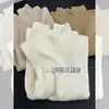 Elegante y suave jersey ajustado con un pequeño cuello alto para mujer, top base de punto de manga larga de cuello medio alto para otoño e invierno