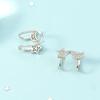 Pendientes de clip de oreja de estrella y luna refinados de alta calidad para mujer, pequeños pendientes de hebilla de estrella de cinco puntas con diamantes frescos sin agujeros para las orejas.