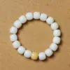 Material de intemperie de raíz de Bodhi de Jade Blanco de Hainan hecho a mano pulido en seco alto lanzamiento espaciador de cuerda trenzada colgante de loto tallado pulsera pulsera