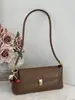 Bolso de axila texturizado casual retro para mujer 2025 nuevo de verano bolso de hombro de nicho francés bolso baguette de moda