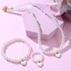 Venta al por mayor de joyas transfronterizas, nuevo colgante de amor para niños, joyería de perlas de agua dulce, traje para niñas, collar, pulsera, anillo
