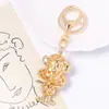 Llavero de Mono Lindo de Dibujos Animados con Boca Grande Colgante Pequeño Pedrería Animal del Zodiaco Mono Amuleto de la Suerte Llavero de Cuerda de Cuero