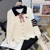 Broche de lazo, bordado de cachorro, suéter de punto de manga larga para solapa, nuevo jersey de estilo universitario otoño e invierno 2026 para mujer