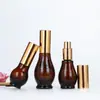 Botella spray oscura de calabaza única marrón envase de cosméticos botella de vidrio vacía botella de emulsión con dispensador marrón en stock al por mayor