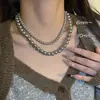 Elegante colar de pérolas cinzas para mulheres, vintage de luxo leve e moderno, 2026 novo popular acessório de gargantilha de nicho atacado