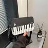 Alto Valor Estético 2026 Primavera Nuevo Color de Moda Bloques de Color Dulce Versátil Estilo Piano Artístico Correa Ancha Hombro Cruzado Bolso de Mano