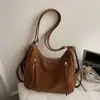 Nueva mochila retro 2026 para mujer, colección otoño/invierno, con un diseño lindo y elegante, gran capacidad, bolso de hombro casual y un bolso tote moderno y minimalista