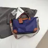 Nova Bolsa Feminina Outono 2025 Bolsa de Bolinho à Prova d'Água Bolsa de Mão para o Trabalho Bolsa de Ombro de Grande Capacidade Bolsa de Viagem ao Ar Livre Portátil