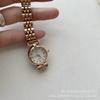 Reloj pequeño dorado clásico retro IEKE esmeralda para mujer, exquisito estilo mid-century, diseño nicho de lujo ligero, reloj de cuarzo