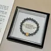 Pulseira Elástica de Corda com Flor Cruzada Dourada Areia, Estilo Dark Moderno, Terahertz, Alta Retenção de Cor, para Mulheres, Pulseira de Moda Personalizada de Alta Qualidade