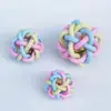 Brinquedo para Cão de Estimação Tpr Bola Colorida com Sino Brinquedo Macaron Treinamento Limpeza de Dentes Divertido Interativo Fabricante Atacado