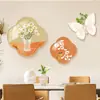 Decoración de pared de fondo para sofá de restaurante y sala de estar moderna minimalista color crema, con una pieza de arte mural luminosa de alta gama con un diseño creativo nórdico