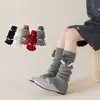 Nuevos estilos de otoño e invierno: calcetines largos engrosados con adorno de lazo para niñas, perfectos para Año Nuevo, proporcionando calor y actuando como calentadores de rodillas y piernas