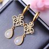Pendientes de ópalo natural estilo chino para mujer Pendientes dorados con nudo auspicioso de arena de moda estilo coreano combinables para socialité elegantes para mujer