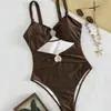 Bestseller Transfronterizo 2027: Traje de baño de una pieza sexy con tirantes, diseño hueco de color sólido de alta gama, concha, corte ajustado