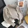 Suéter perlado de punto suave y delicado con cuello redondo, nuevo diseño francés de otoño e invierno, top de punto holgado de nicho