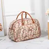 Bolsa de viaje portátil directa de fábrica, bolsa de equipaje, bolsa de regalo de PU, bolsa de tamaño, bolsa de embarque de viaje corta impermeable, venta al por mayor