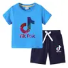 Nueva Camiseta de Verano 2026 para Niños Ropa Infantil de Comercio Exterior Estilo Coreano Ins Algodón Manga Corta y Pantalones Cortos Conjunto de Dos Piezas para Niños