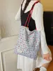 Bolsa de lunares de nicho súper popular estilo coreano para mujer 2026 Nueva bolsa versátil de un solo hombro para llevar debajo del brazo Bolsa pequeña de mano para salir a trabajar