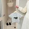 Camiseta infantil de manga corta de moda estilo coreano, nueva ropa de bebé para el verano 2026, top versátil con estampado de dibujos animados a la moda