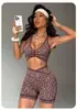 Nuevo conjunto de yoga europeo y americano con estampado de leopardo, con sujetador deportivo de color contrastante, shorts de cintura alta para levantar glúteos y apretar el abdomen, ropa de fitness