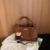 Bolso pequeño de cadena acolchado estilo Chanel con patrón de rombos, un bolso de axila vintage versátil y único, un bolso de mano delicado que se puede llevar en la mano o cruzar sobre el cuerpo