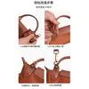 Venta al por mayor transfronteriza adecuada para la transformación de la correa de hombro para bolso mini Longxiang, correa para bolso bandolera sin perforaciones, correa para bolso mini tipo dumpling
