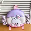 Mochila de dibujos animados con forma de conejo y caramelo para niños y niñas, con un diseño de color contrastante y un patrón de cáscara de huevo, un nuevo estilo de mochila pequeña para niños de preescolar