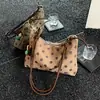 Bolso de hombro de lunares fresco y dulce para mujer, nueva moda 2026, elegante bolso de axila con un toque de alta gama, versátil para el trabajo